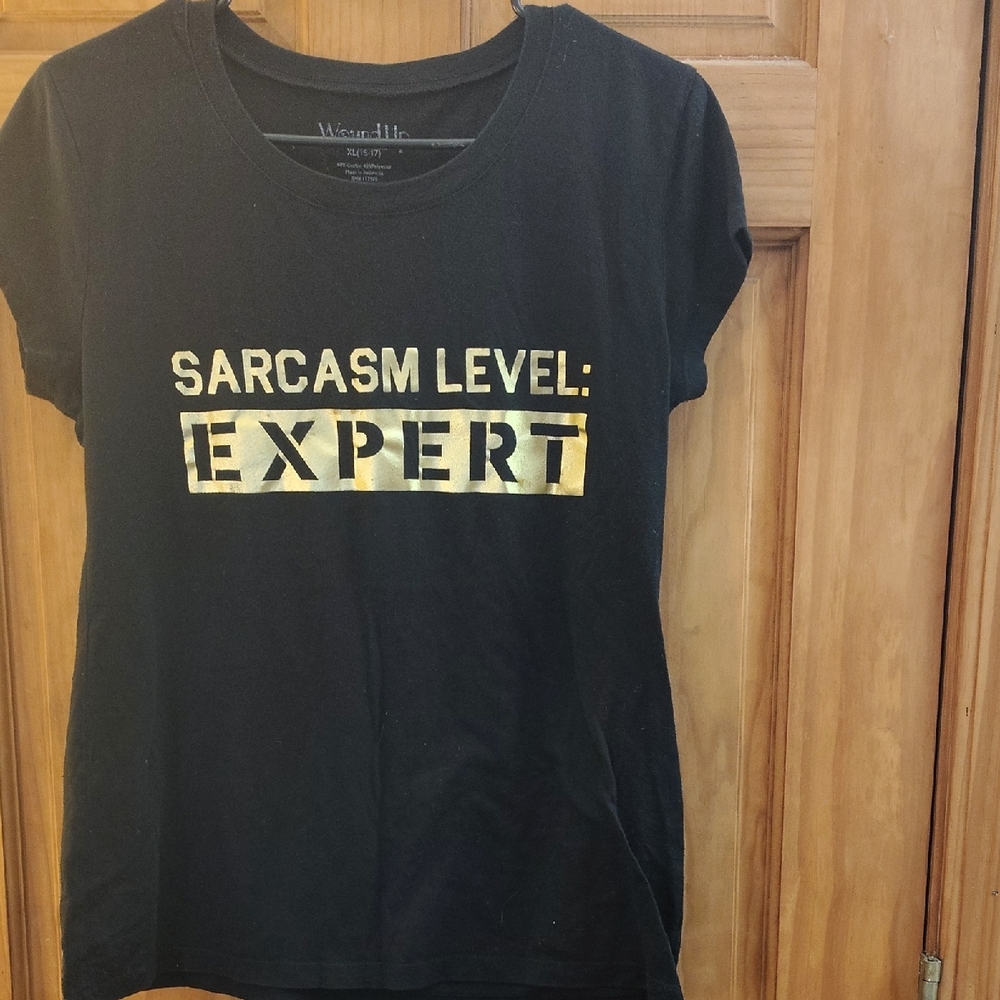 Wound Up Black Tee with Gold Sarcasm Print